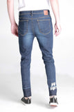 Carrot Fit Jeans With Raw Edge And Embroidery Detail